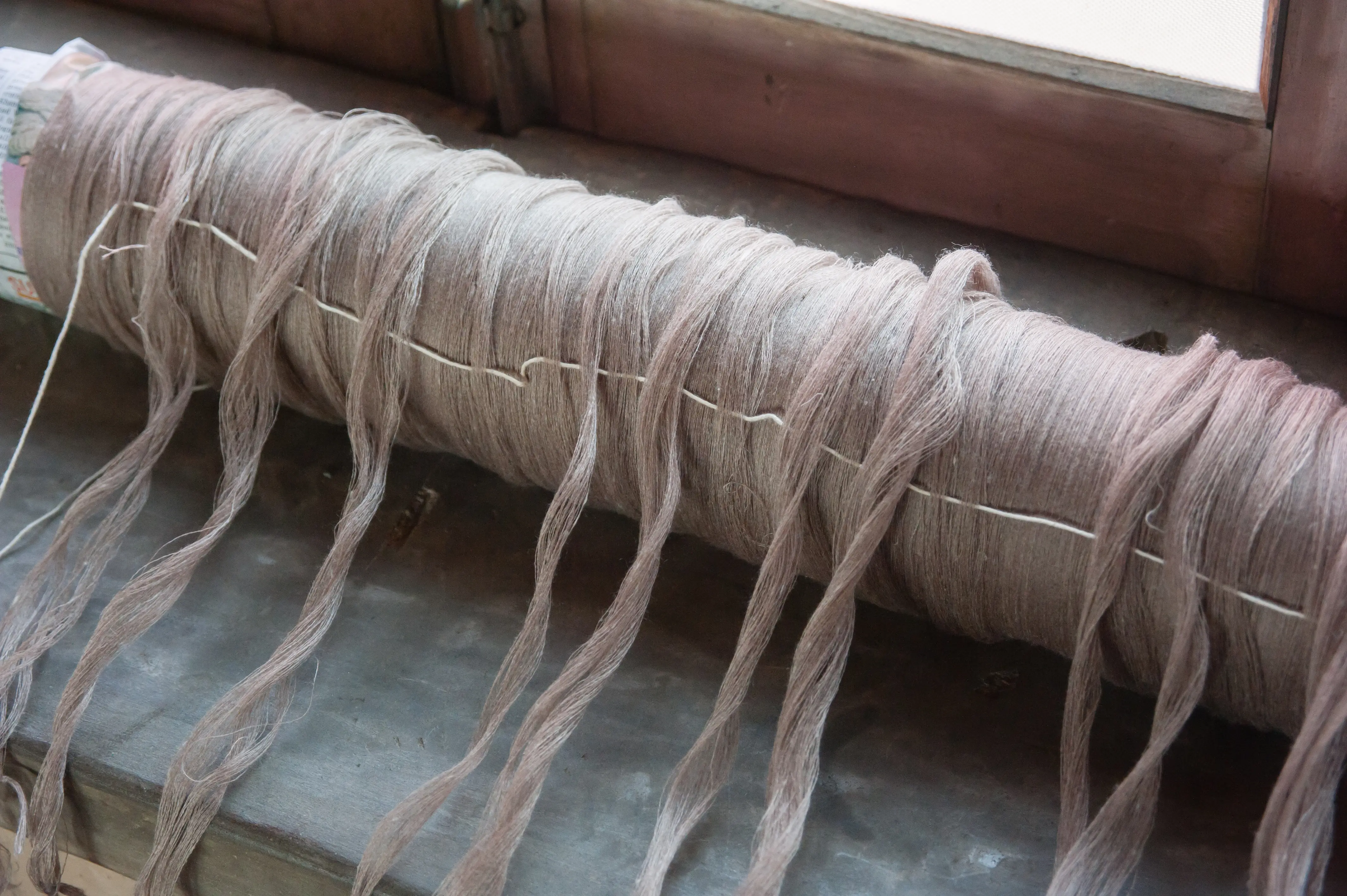 Warping — yarn wound onto the loom beam